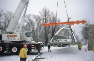 Workers installing a pedestrian bridge with Greiner's 200-ton and 150-ton mobile cranes