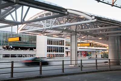 Architecturally exposed structural steel pipe trusses at an airport